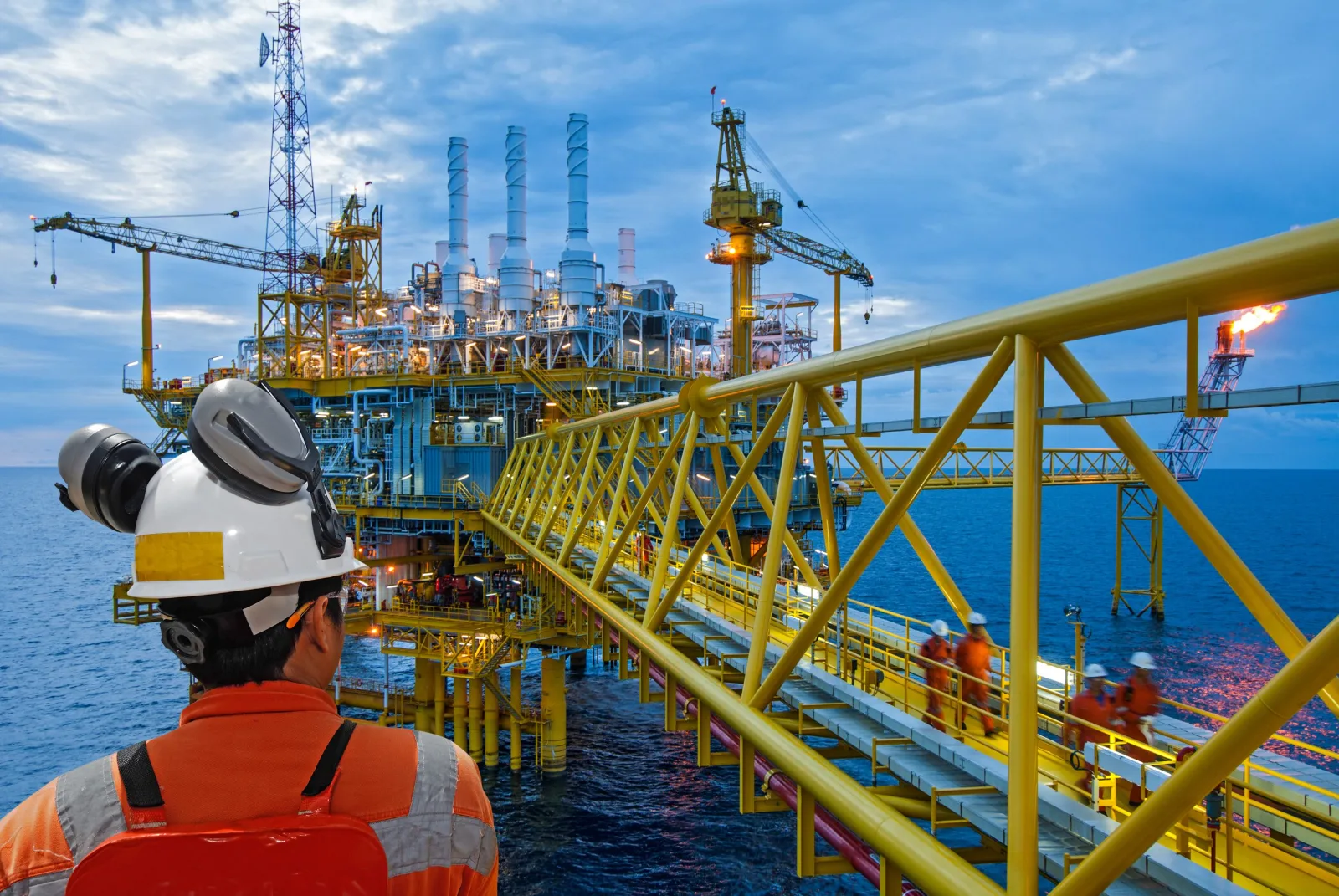 Engineer overlooking an offshore production platform